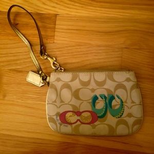 Gold coach wristlet